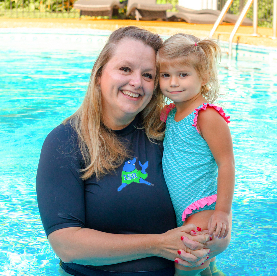 A woman and child in the pool